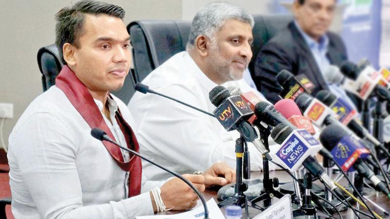 Sports Minister Namal Rajapaksa (left) and Minister of Tourism Prasanna Ranatunga talk to the media. Minister Rajapaksa became the proud father of his first born, a baby boy yesterday (Pic by Sulochana Gamage) 