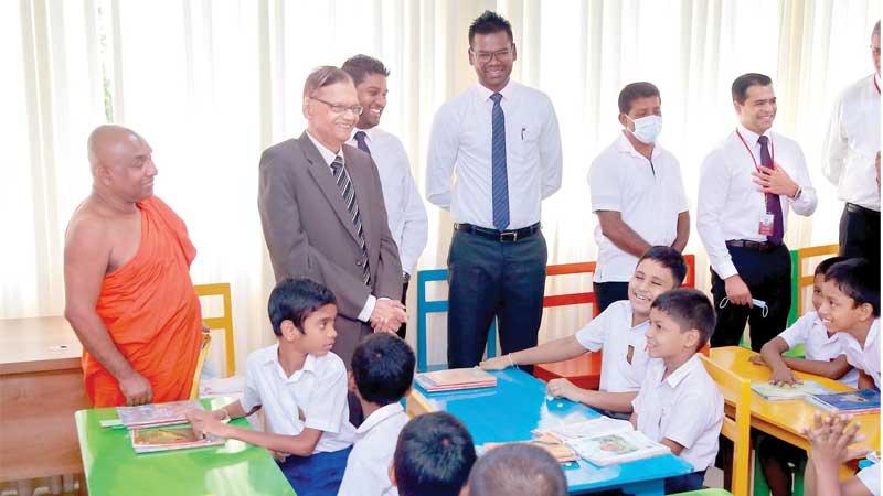 Education Minister G.L. Peiris has a word with the students of Samayawardena Vidyalaya.   