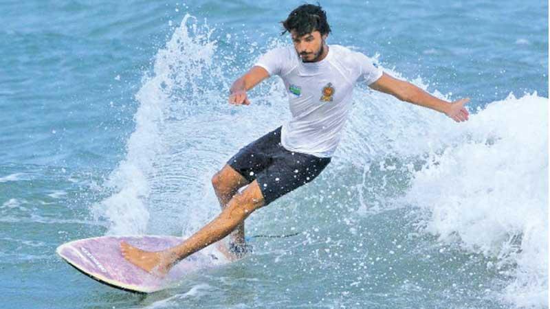 Lakshitha Madushan who won the National surfing title rides the waves at Arugam Bay in Pottuvil in the eastern province (Pic by Sulochana Gamage)