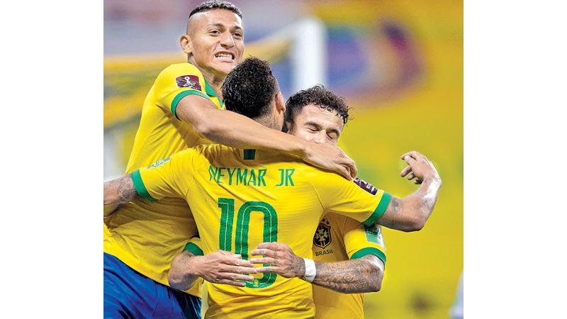 Brazil’s Roberto Firmino celebrates his goal