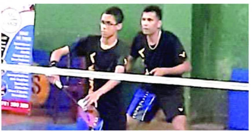 Jason Homer (front) plays in a Doubles match with his father Clarence