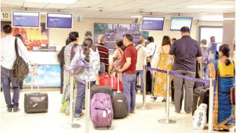 Expat workers at check-in counters at the BIA