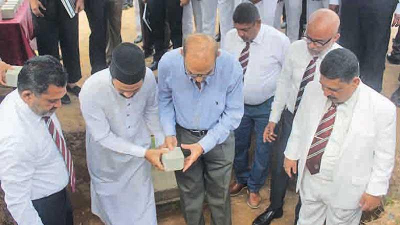 Firoze Limited Chairman and Phoenix Ventures Limited  Director   Mohamed Haji Omar laying the foundation stone in the presence of Zahira College principal Trizviy Marikkar, Chairman of the Board of Governors Fouzul Hameed, Old Boys Association President Naina Mohamed, Project Chairman Jisthy Fahmi and Ash Sheik Arkam Nooramith. Pic: by Ruzaik Farook