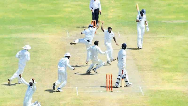 Muralitheran celebrates taking his 800th wicket in a Test match against India in Galle in 2012 before retiring