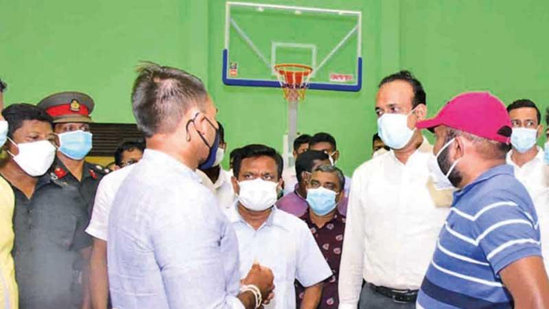 Sports Minister Namal Rajapaksa inspecting the Dadalla Sports Complex which is to have a new Volleyball House very soon while having a discussing with Plantations Minister Ramesh Pathirana and Volleyball president the Deputy Speaker Ranjith Siyambalapitiya