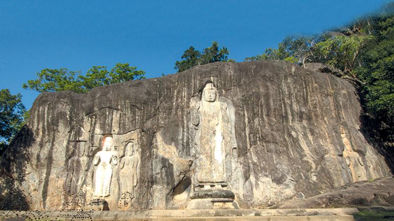 The magnificent seven rock-hewn statues at Buduruwagala rock in Wellawaya