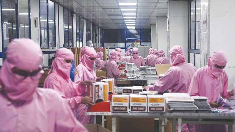 A worker at the Hindustan Syringes factory at Faridabad (AFP)