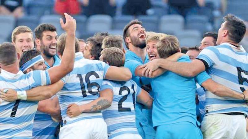 The triumphant Argentina players celebrate victory over New Zealand