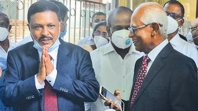 Former Secretary to the President Lalith Weeratunga (on right) and former Telecommunications Regulatory Commission (TRC) Director General Anusha Palpita after being cleared of all charges by court. Pic: Ranjith Asanka