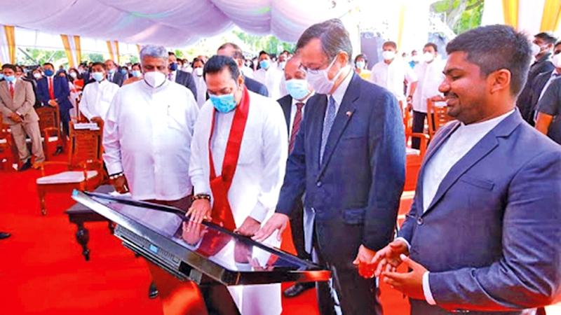 Prime Minister Mahinda Rajapaksa, Tourism Minister Prasanna Ranatunga, Aviation and Export Zones Development State Minister D. V. Chanaka and Japanese Ambassador to Sri Lanka Akira Sugiyama at the commencement of Phase II of the Bandaranaike International Airport Expansion Project 