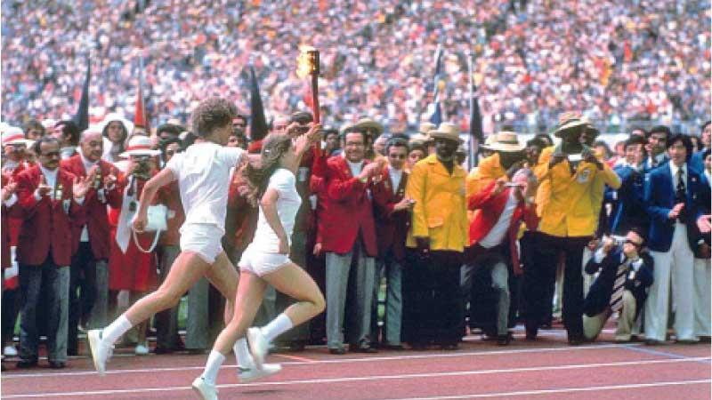 First duo to light Olympic Flame, Stephane Prefontaine and Sandra Henderson