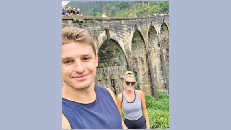 Beauden Barrett with his wife during a tour of Sri Lanka where he poses near the landmark Nine Arch Bridge at Ella in the Budulla district after trekking along the rail track through tea estates and vegetation for one and a half hours