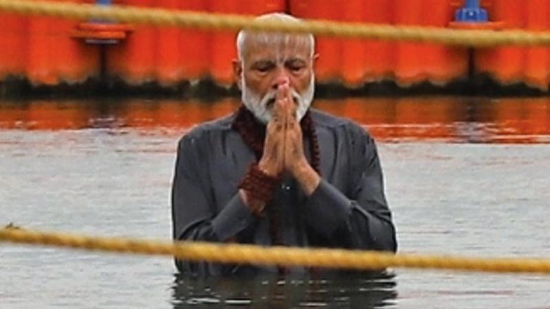 Indian Prime Minister Narendra Modi prays after taking a dip on the confluence of the Ganges, Yamuna and mythical Saraswati rivers, during ‘Kumbh Mela’ in Prayagraj