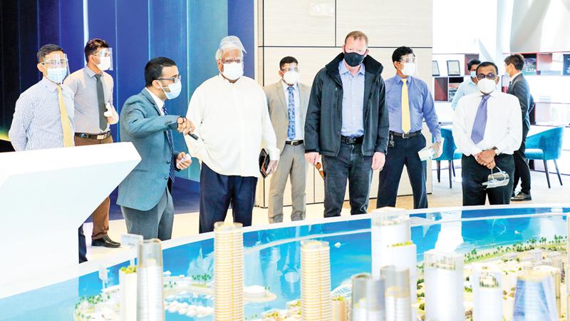  Nathaniel Rothschild and his delegation take a look at an artist’s  impression of the Port City project.