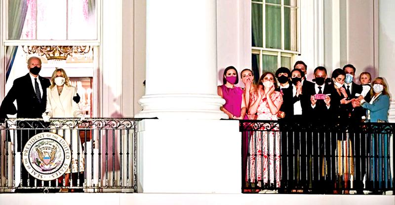 President Joe Biden and First Lady Dr. Jill Biden watch fireworks from the White House alongside family members (AFP)