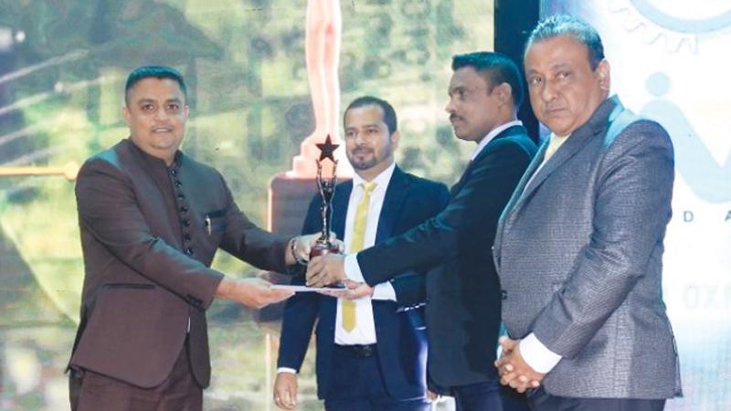 Managing Director of Mount House Holdings, T.M. Pamal Ruwansiri receives the award