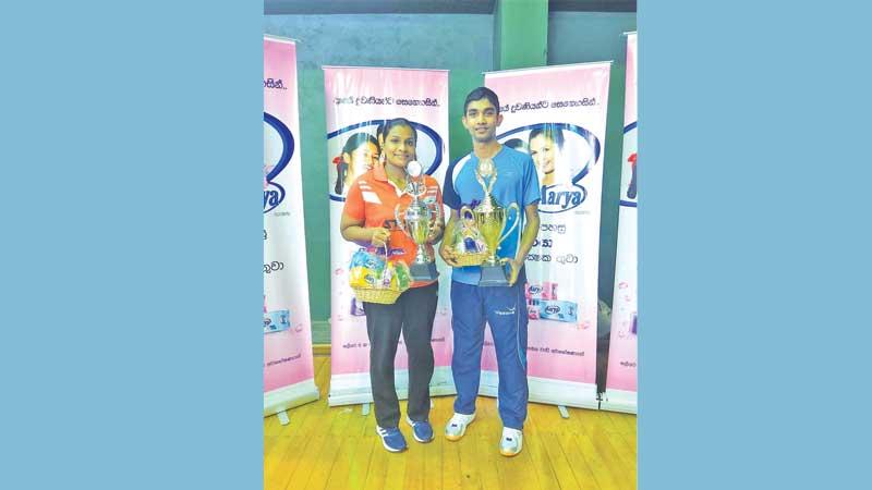 Chameera Ginige the men’s winner (right) and Ishara Madurangi the women’s champion pose with their trophies