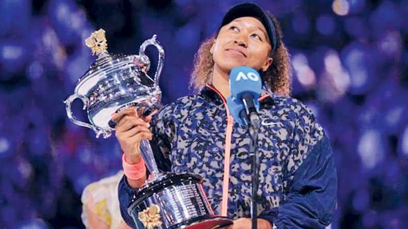 Naomi Osaka lifts the Melbourne Open Cup