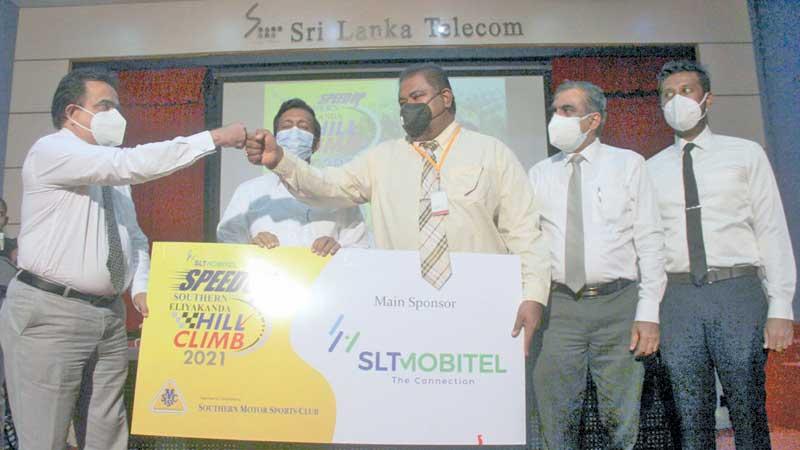 Chief Marketing Officer of SLTMobitel Prabath Dahanayake presents the sponsorship to the president of the Southern Motor Sports Club Dr. Sanjaya Sedera Senarath. The other co-sponsors for the Hill Climb are Mobil, Wurth, Merchant Bank and Motor Sports Network as the Media Partner. (Pic by Saliya Rupasinghe)