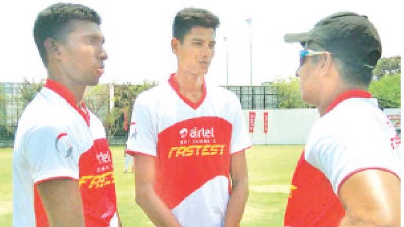 Flashback to May 2019: Chaminda Vaas imparts fast bowling tips to two village boys, Steven Soosai (left) and MRM Rimzi at a private clinic in Colombo