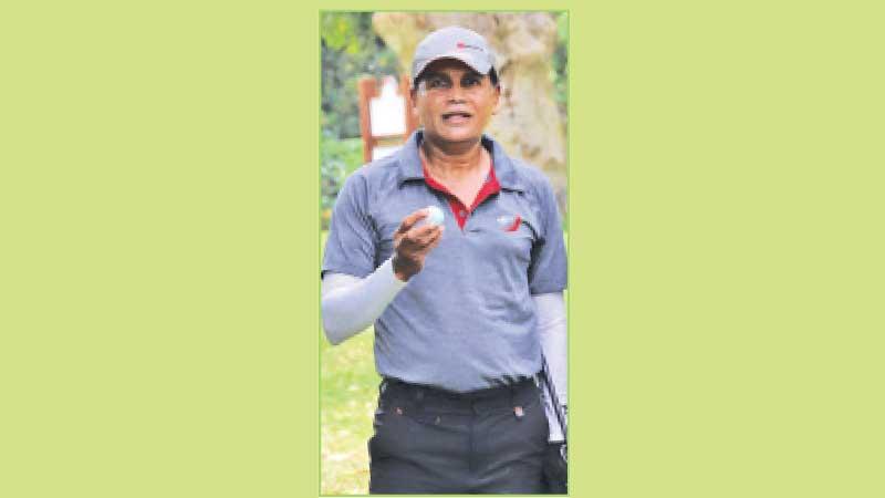 Ravi Liyanage with  the hole in one ball
