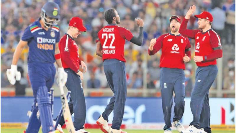England team congratulates J. Archer during the game