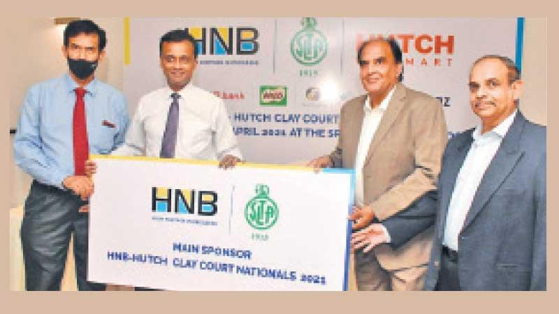 Chammika Weerasinghe (second from left) - Head of Marketing, HNB, handing over the token sponsorship cheque to Iqbal Bin Issack (President, SLTA). Also in the picture are S. Sudarshan (Treasurer SLTA and Pradeep Goonasekera (Tournament Director SLTA)