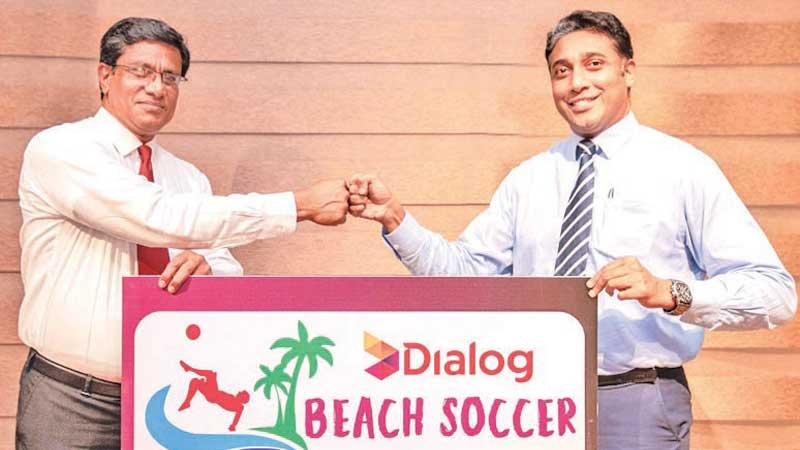 Anura de Silva, president, FFSL (L) and Harsha Samaranayake, Senior General Manager – Brand and Media, Group Marketing of Dialog at presentation of the logo of the Dialog Beach Soccer Championship 2021