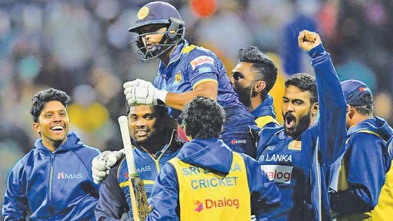 Asela Gunaratne is carried by Sri Lanka team-mates after he played a match winning innings against Australia in an ODI