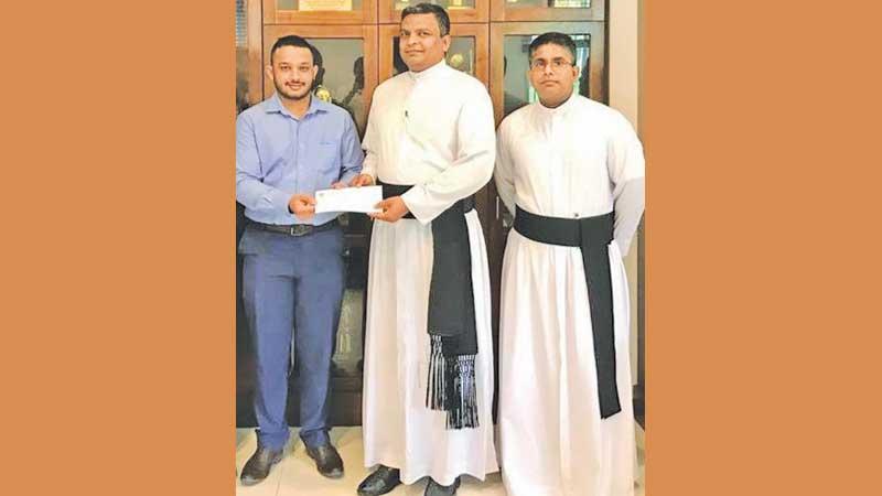 From left: Senel Rohana, Rev. Fr. Rohitha Rodrigo (Rector) and Rev. Fr. Chanaka Jansze at the launching of the scholarship in memory of the late tennis master in charge of St. Peter’s College Bernard Jesudasan