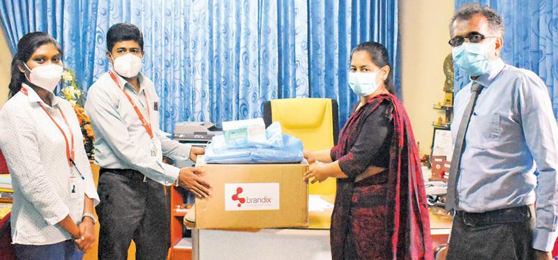 Brandix team members handing over PPE to Dr. (Ms.) V. W. Mihiri  Priyangani – Director of the Kegalle Teaching Hospital 