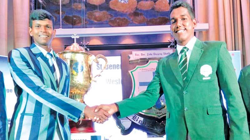 St. Benedict’s College captain Kaviru Perera (right) and Wesley College skipper Thenuka Perera shake hands ahead of the Cup and Shield they will play for