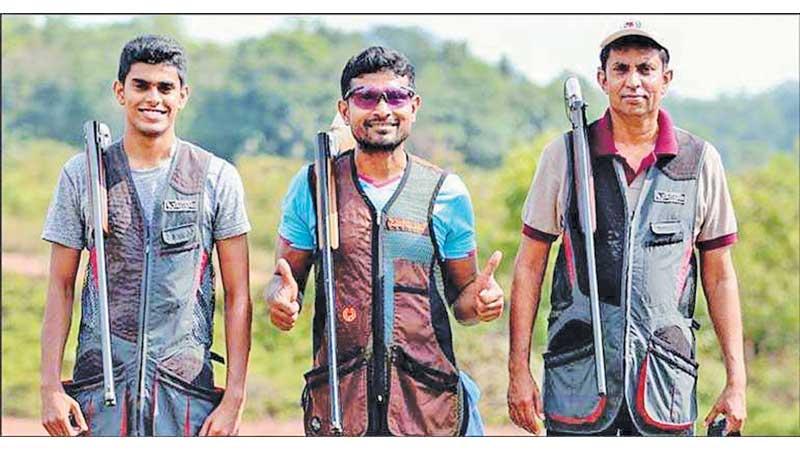 Champion shooter Rishan Dias flanked by Muditha Samaranayake (L) and Ambrith Samaranayake (R)
