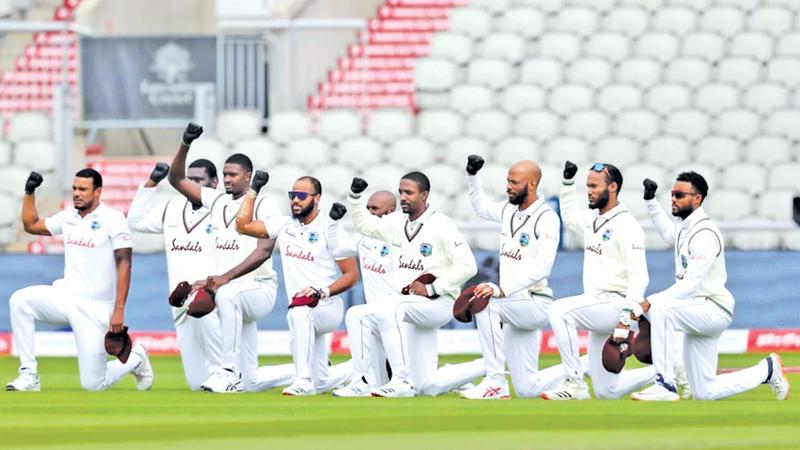 The West Indies players take a knee bow on the tour of England