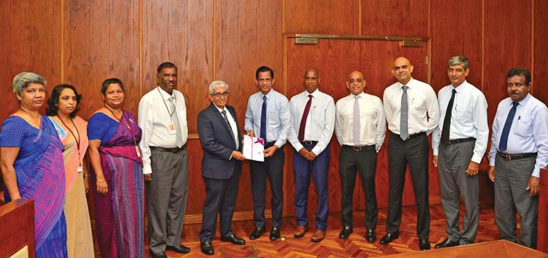 The presentation of the  “Code of Conduct of Licensed Finance Companies Sri Lanka” by FHA Council members to Central Bank Governor Prof. W D Lakshman.  Looking on are Deputy Governor Mrs. T. M. J. Y. P. Fernando, Assistant Governor J. P. R. Karunaratne,  Addl. Director, Dept. SNBFI Mrs. R. M.  C. H. K. Jayasinghe and Additional Director, Dept. of SNBFI  Mrs. A. P Liyanapatabendi.