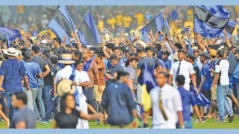 Flags flutter at the Royal-Thomian