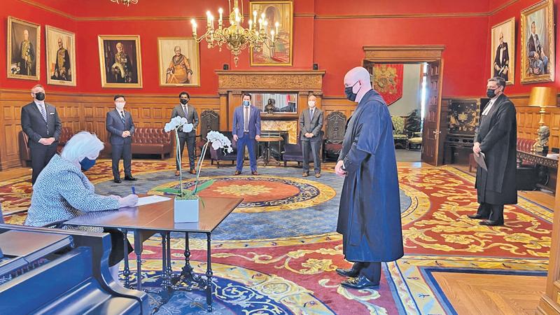 Lieutenant Governor of Ontario, Elizabeth Dowdeswell, signing the Royal Assent officially bringing the Bill into effect. (Courtesy: Tamil Guardian)
