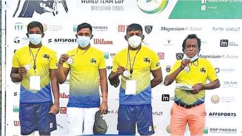 Sri Lanka wheelchair tennis team of Gamini Dissanayake, Suresh Ranaweera and Dharmasena with coach Jagath Welikala