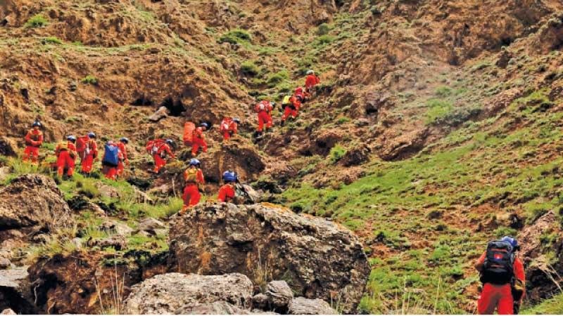 Rescue workers go in search of missing runners