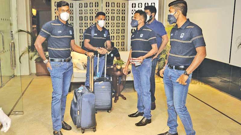 Sri Lankan players wait to leave their hotel in Colombo bound for England