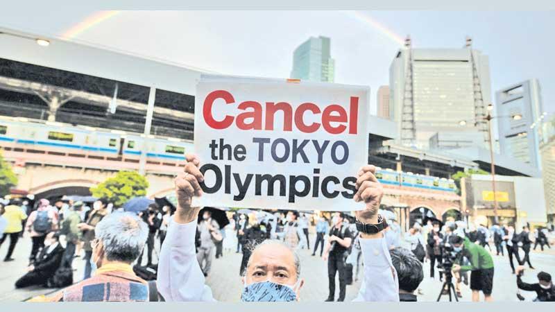 A protester calls for the scrapping of the Games 