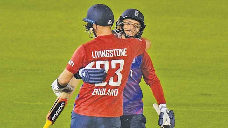 England batsmen Liam Livingstone and Sam Curran celebrate winning the T20 series against Sri Lanka in Cardiff on Thursday