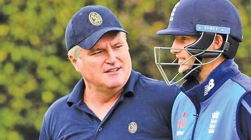 In this file photo England captain Joe Root (R) chats with former Australian spinner Stuart MacGill (L) during training at the SCG in Sydney in January 2018