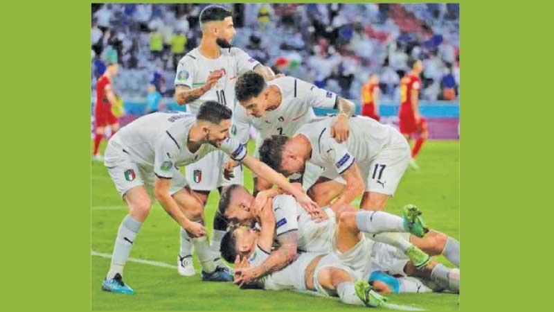 Italy’s players celebrate their win over Belgium in the Euro quarter finals