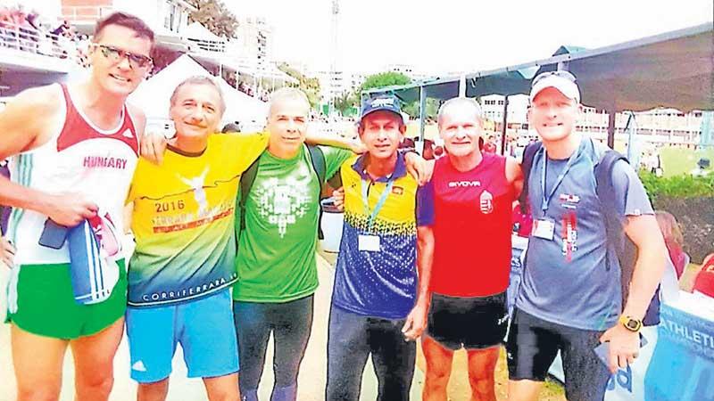 Ranjan Jayatilaka with competitors during the World Masters in Indonesia