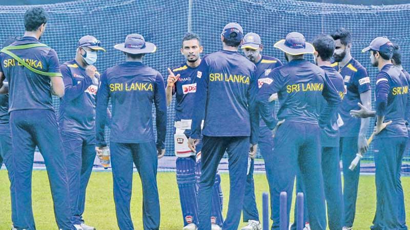 Sri Lanka squad members come together for a meeting with skipper Dasun Shanaka at a practice session