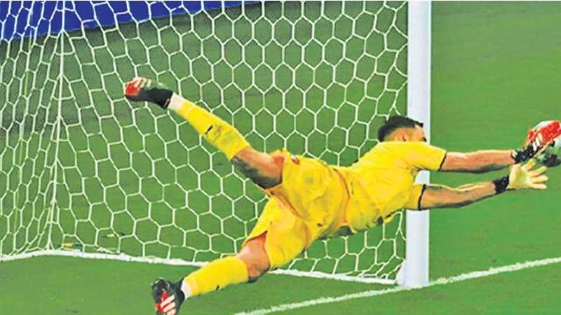 Italy goal keeper Gianluigi Donnarumma makes the most important save of his career to signal victory