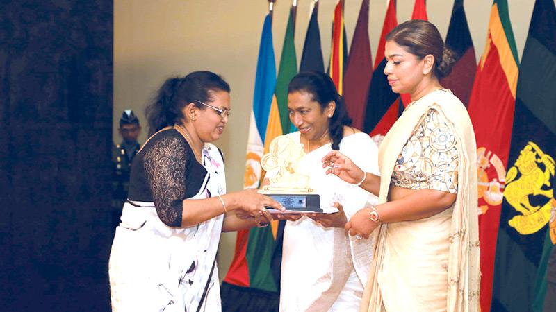 First Lady Ioma Rajapaksa makes a presentation