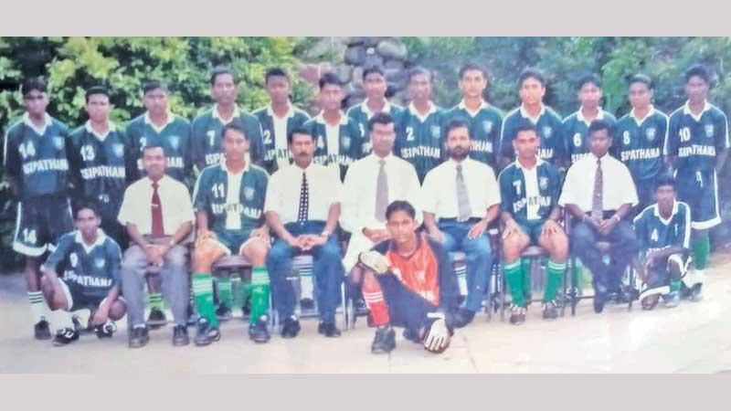 Seated from left: M.H. Yakeem (coordinator), Sriyantha (captain), Gamini Sarathchandra (POG), Upali Gunasekera (Principal), Palitha (MIC), Ranga, Sarath (coach). Standing from left: Doole, Ruwan, Irshad, Tidiman, Shafie, Lanka, Vikum, Rajan, Isanka, Wettasinghe, Rukshan, Shulhie, Leonard. Squatting from left: Sudharshan, goal keeper Asanka Bandara and Akila