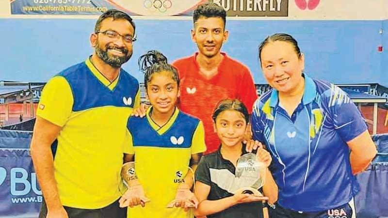 Eight times National TT champion Thilina Piyadasa (left) with his two daughters Tashiya and Tiana and former National champion Udaya Ranasinghe with Olympic silver medalist Gao Jun who is the owner and coach of California TT Club 